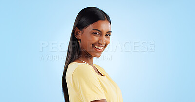 Buy stock photo Portrait, smile and Indian woman with joy, fashion and happiness on a blue background. Profile, face and person with casual outfit, excited and model with mockup space, student and happy with joy