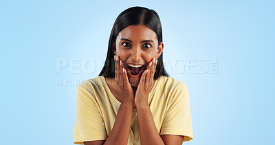 Buy stock photo Excited, woman and crazy portrait with wow, surprise and winner with a smile in a studio. Blue background, happy and celebration with female person shocked from omg announcement and achievement