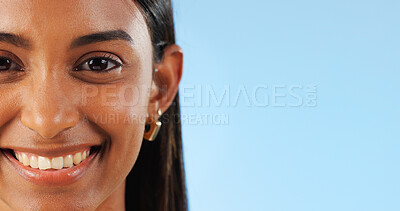 Face, teeth whitening and dental, woman with smile for oral care and wellness on blue background. Beauty, hygiene and orthodontics with mockup space, portrait and healthy in studio with veneers