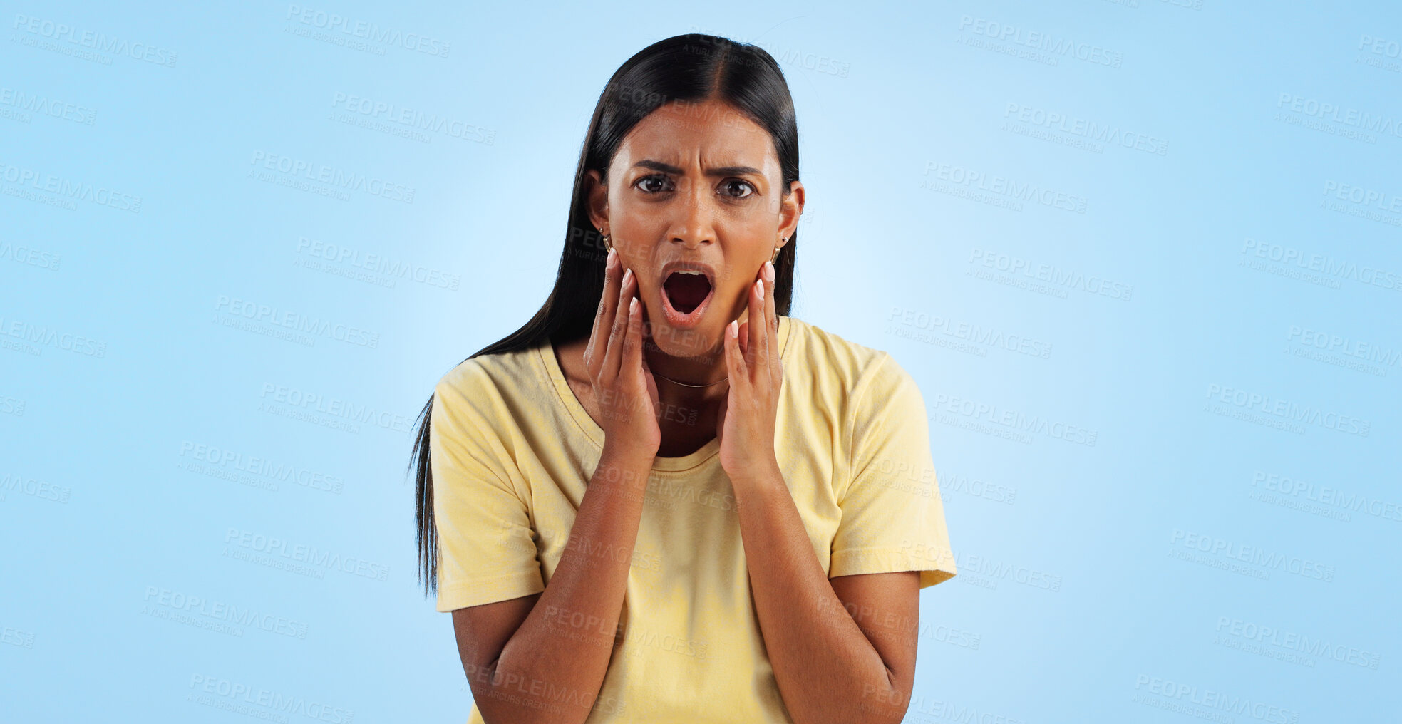 Buy stock photo Shock, surprise and woman in portrait in studio with reaction, facial expression and horror on blue background. Open mouth, wow for news or announcement, mockup space and gossip drama with mind blown