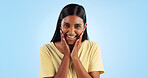 Excited, Indian woman and portrait with wow, surprise and winner with a smile in a studio. Blue background, happy and celebration with female person with motivation from announcement and achievement