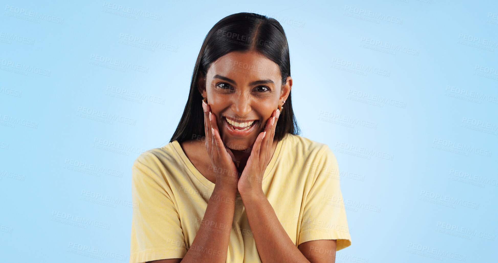 Buy stock photo Excited, Indian woman and portrait with wow, surprise and winner with a smile in a studio. Blue background, happy and celebration with female person with motivation from announcement and achievement