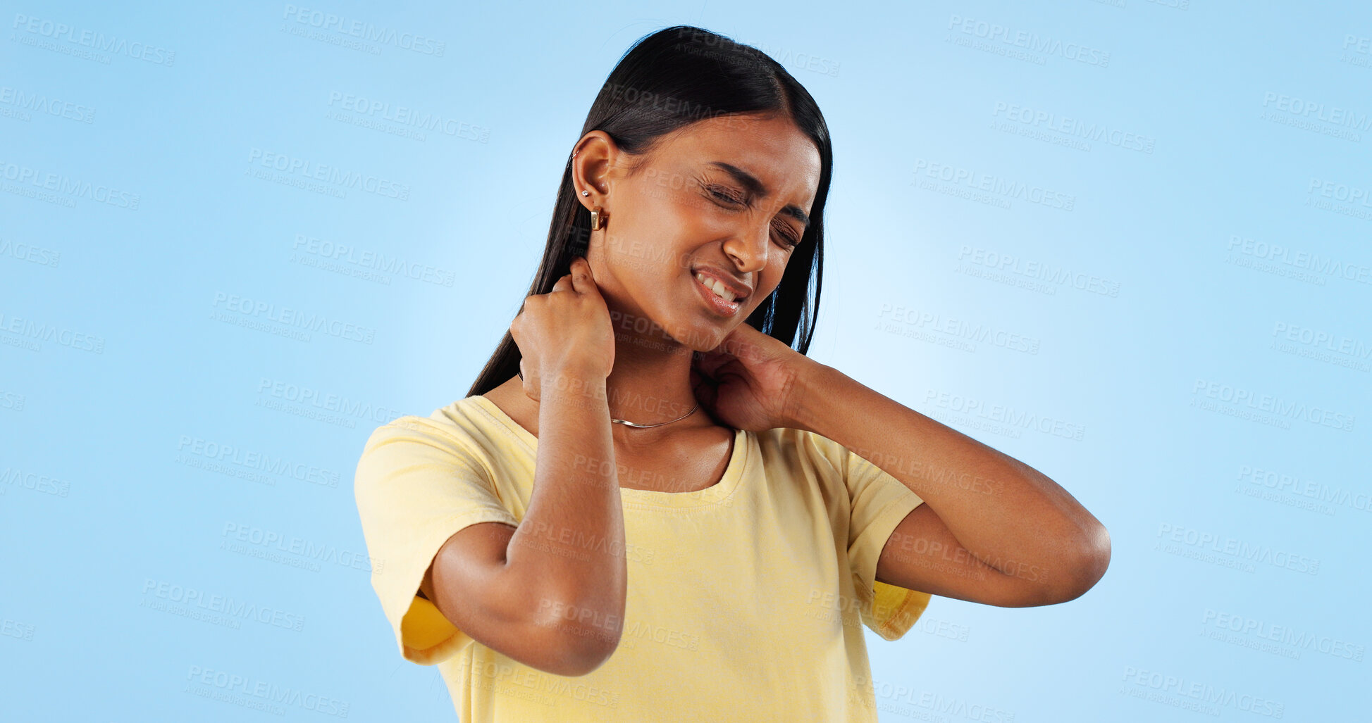 Buy stock photo Neck pain, health and woman in studio with spine issue, emergency and bad posture on blue background. Muscle, pressure and fibromyalgia, sick with burnout and injury, mockup space and inflammation