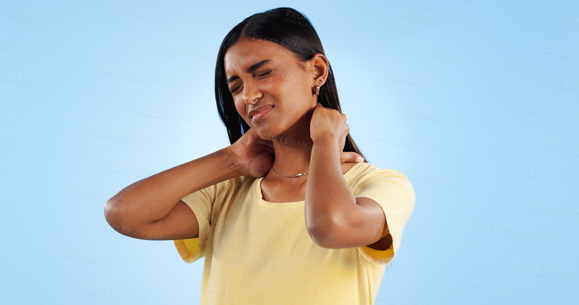 Buy stock photo Neck pain, healthcare and woman in studio with spine issue, emergency and bad posture on blue background. Muscle pressure, fibromyalgia and sick with burnout and injury, mockup space and inflammation