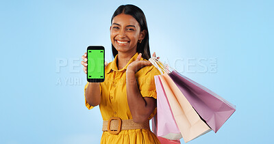 Phone green screen, shopping bag and portrait of happy woman show online discount, sales deal info or studio promo. Tracking markers, cellphone chroma key and mockup space customer on blue background