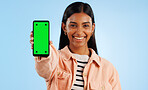 Smartphone green screen, happy portrait and woman show web communication, mobile search engine or app chroma key. Tracking markers, cellphone mockup space and studio tech person on blue background