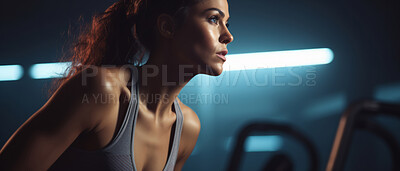 Candid shot of fitness woman in gym. Dynamic light. Fitness concept.