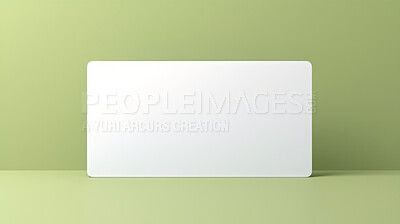 Blank white business card or gift voucher card on a green background. Birthday gift