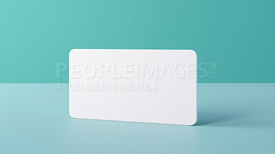 Blank white business card or gift voucher card on a turquoise background. Birthday gift