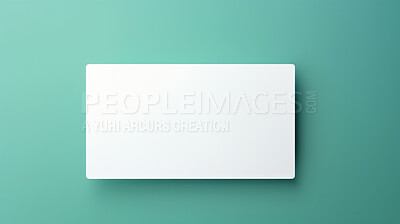 Blank white business card or gift voucher card on a teal background. Birthday gift
