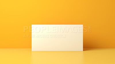 Blank white business card or gift voucher card on a yellow background. Birthday gift