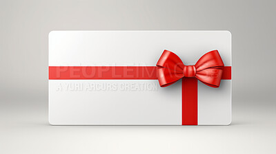White gift card with red bow on a plain white background. Voucher or birthday gift