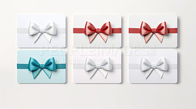 Various gift cards with bows on a plain white background. Voucher or birthday gift