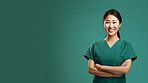 Friendly medical doctor or nurse in green uniform scrubs on copyspace background.