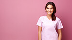 Friendly medical doctor or nurse in pink uniform scrubs on copyspace background.