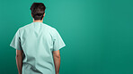 Friendly medical doctor or nurse in green uniform scrubs on copyspace background.