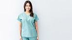 Friendly medical doctor or nurse in blue uniform scrubs on copyspace background.