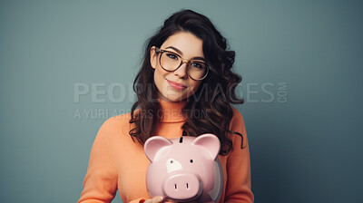 Young woman holding a piggy bank. Savings, budget and money management concept