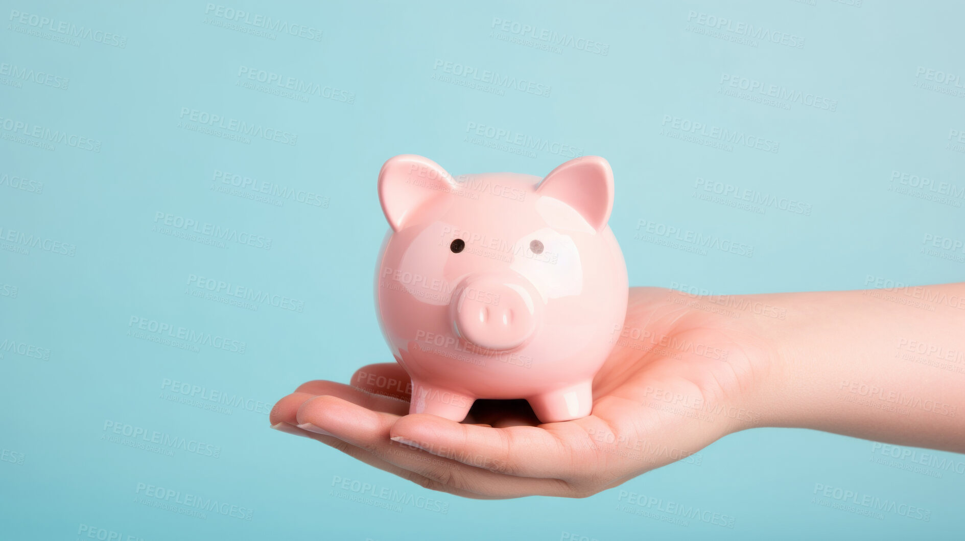 Buy stock photo Hand holding a piggy bank. Savings, budget and money management concept