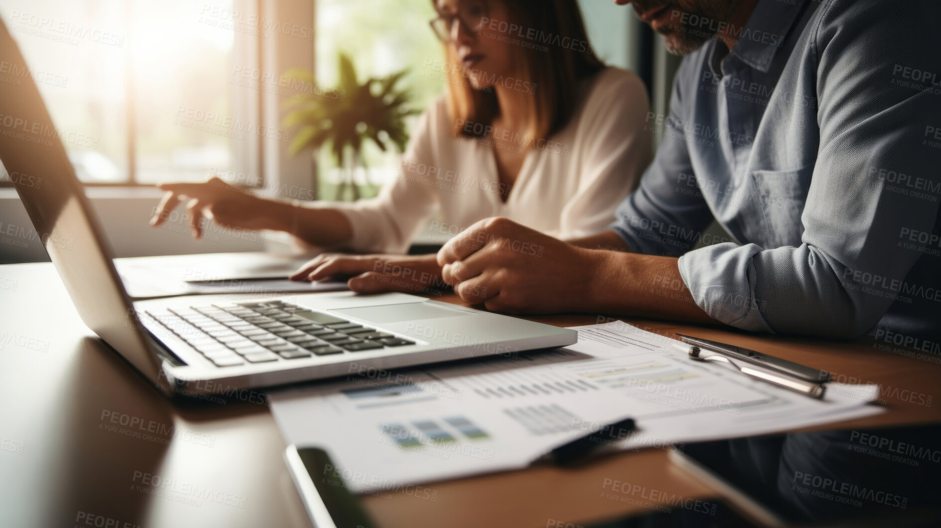 Buy stock photo Couple managing finance with wireless technology. Shot of couple using a laptop