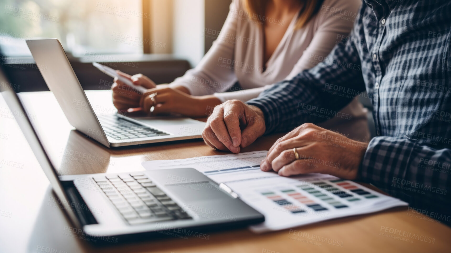 Buy stock photo Couple managing finance with wireless technology. Shot of couple using a laptop