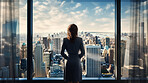 Silhouette of a businesswoman or executive looking at cityscape from office window