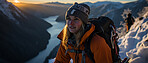 Candid shot of hiker on mountain top. Snowy mountain. Extreme sport concept.