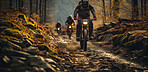 Group of mountain bikers on muddy tack in forrest. Extreme sport concept.