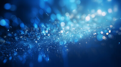 Blue glitter glow particle bokeh background. Festive celebration wallpaper concept
