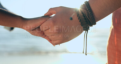 Buy stock photo Love, zoom and couple holding hands at a beach with respect, gratitude and trust in nature together. Commitment, closeup and people together at sea with support, kindness and summer travel freedom