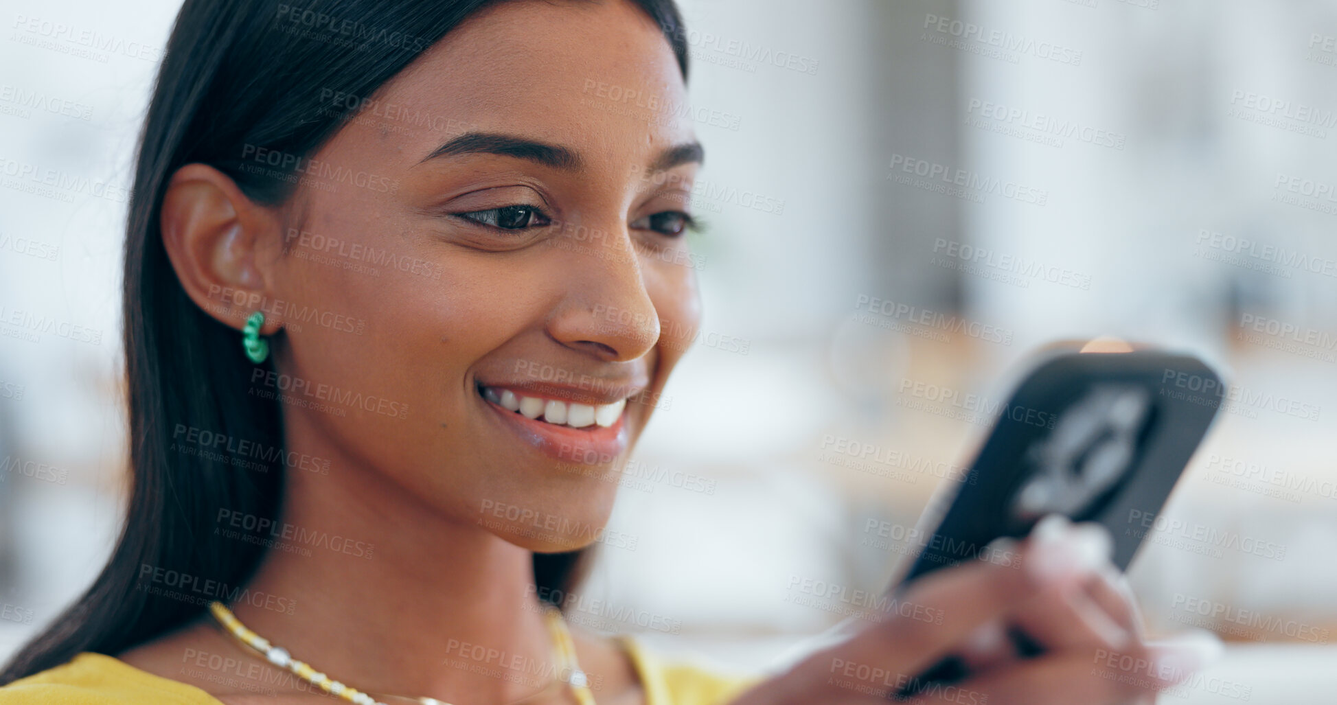 Buy stock photo Happy, Indian woman and reading with phone for social media in home with funny meme, post or blog online. Internet, search and communication with cellphone to chat, contact or network with a smile