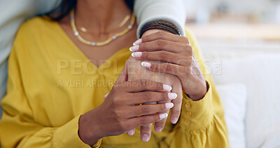 Buy stock photo Couple, closeup and holding hands on sofa in home living room together for support, bonding and love with care. People, helping and consulting for empathy, kindness and connection with trust in house