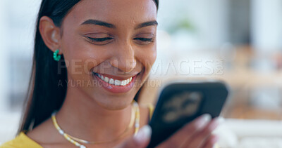 Buy stock photo Happy, Indian woman and reading social media with phone in home with funny meme, post or blog online. Internet, search and communication with cellphone to chat, contact or network with a smile