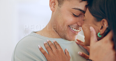 Buy stock photo Face, love and smile with a couple closeup in their apartment together for care, romance or bonding. Relax, support or touching moment with a happy young man and woman in their home on the weekend