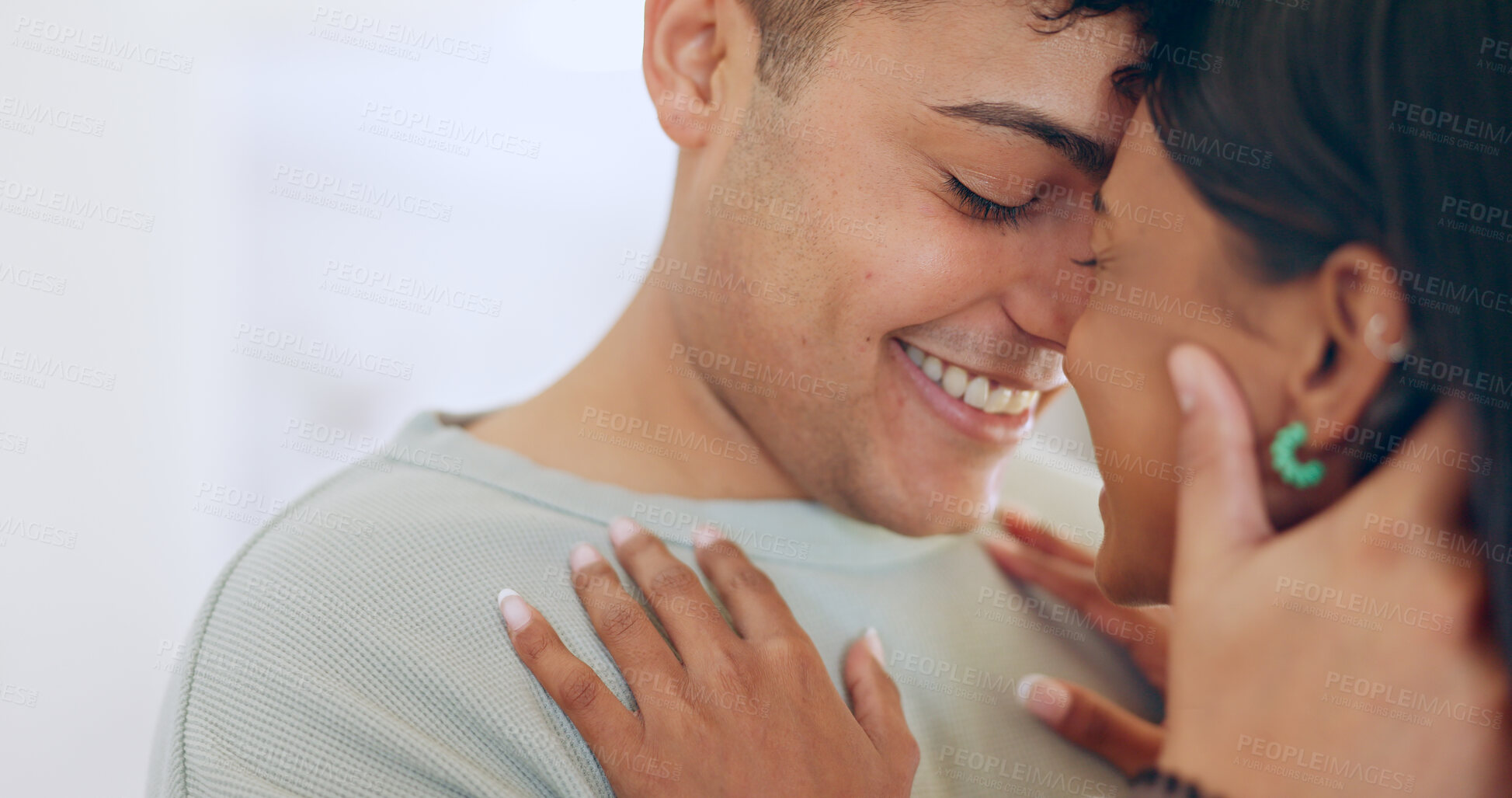 Buy stock photo Face, love and smile with a couple closeup in their apartment together for care, romance or bonding. Relax, support or touching moment with a happy young man and woman in their home on the weekend