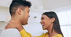 Happy, couple is dancing in kitchen and hug for love with affection, bonding and romantic date at home. Fun, interracial people and commitment, loyalty and respect in healthy relationship with laugh