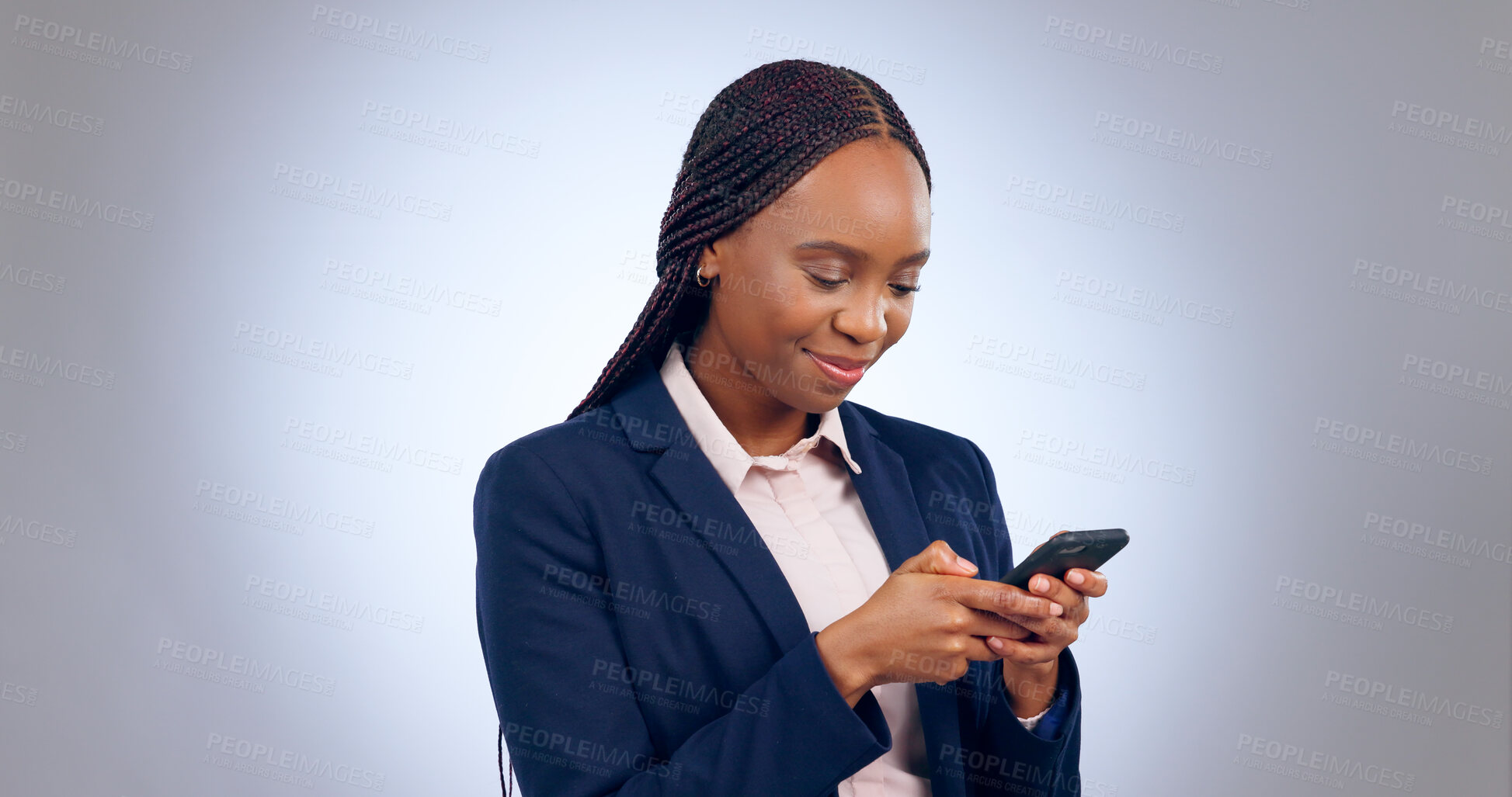 Buy stock photo Business woman, studio and smartphone for reading notification, mobile chat and social network. Happy african worker scroll on cellphone, news app and search digital information on grey background 