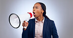 Megaphone, speech and angry business woman in studio for  change, transformation or freedom on grey background. Corporate, justice and female speaker with bullhorn noise for announcement attention