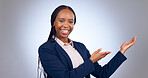 Portrait, business woman and presentation of space, mockup or announcement of promotion in studio on grey background. Happy african worker advertising launch of deal, feedback or information about us