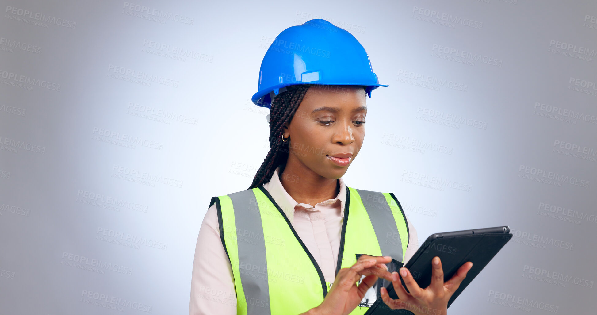 Buy stock photo Black woman, engineer and typing on tablet in studio isolated on white background mockup space. Technology, architect and research on internet, digital app or planning construction for communication