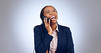 Business woman, phone call and laugh in studio for consulting, chat to contact and networking on grey background. Happy african employee, cellphone or communication of feedback for funny conversation