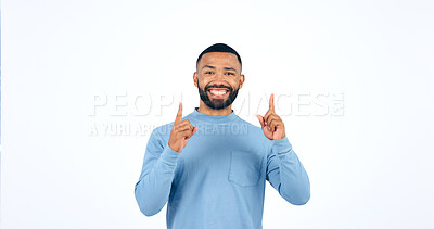 Buy stock photo Happy, face and man with hand pointing up in studio for announcement, info or promo on white background. Smile, portrait and excited male model show giveaway, deal or lottery competition prize offer