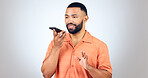 Man in studio with voice phone call, smile and talking with connection for networking, online chat or communication. Happiness, discussion and person with smartphone conversation on white background.