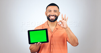 Buy stock photo Portrait, man and ok for tablet with green screen, space or advertising agreement in studio on white background. Happy model, digital marketing and yes emoji for promotion, sign up deal or newsletter