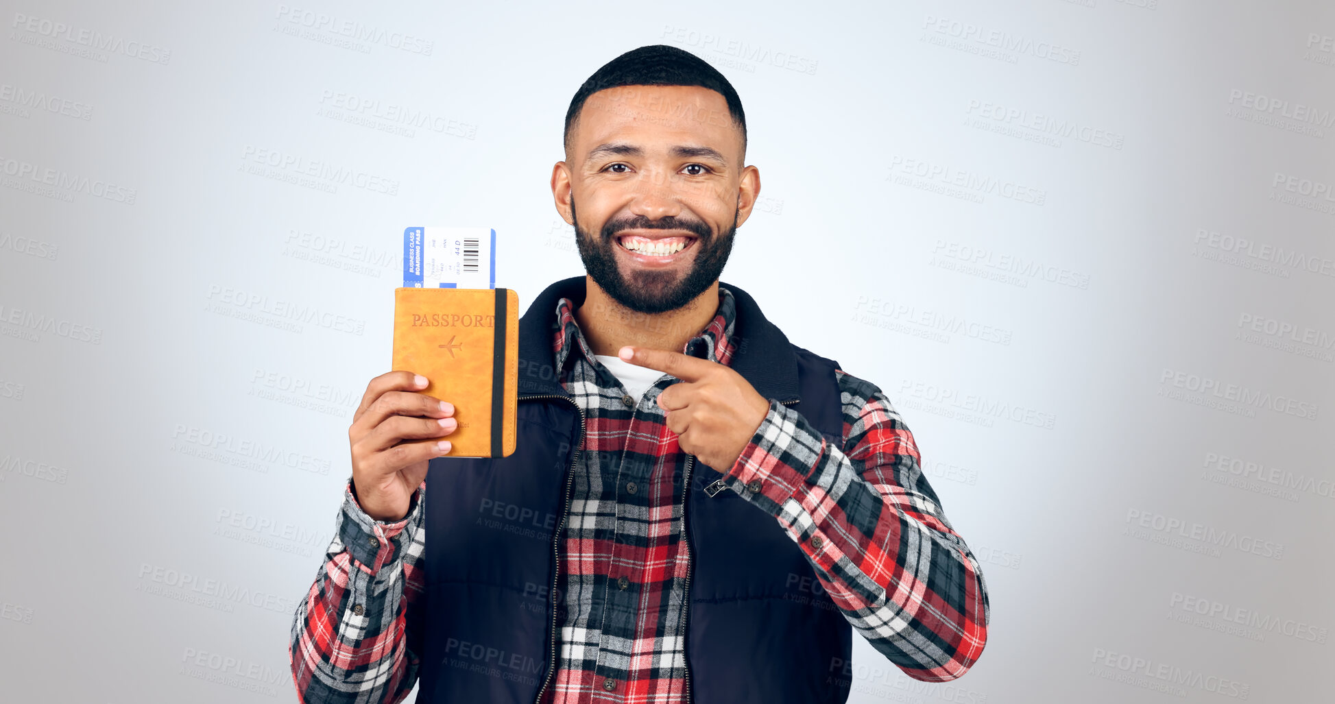 Buy stock photo Pointing, portrait and man with a passport, smile and vacation on white studio background. Face, model and tourist with a ticket, hand gesture and travelling with mockup space, getaway and holiday