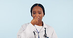 Portrait, black woman and doctor touch nose in studio isolated on blue background mockup space. Face, sick and African medical professional with allergy, sinus and cold fever, covid virus or bacteria