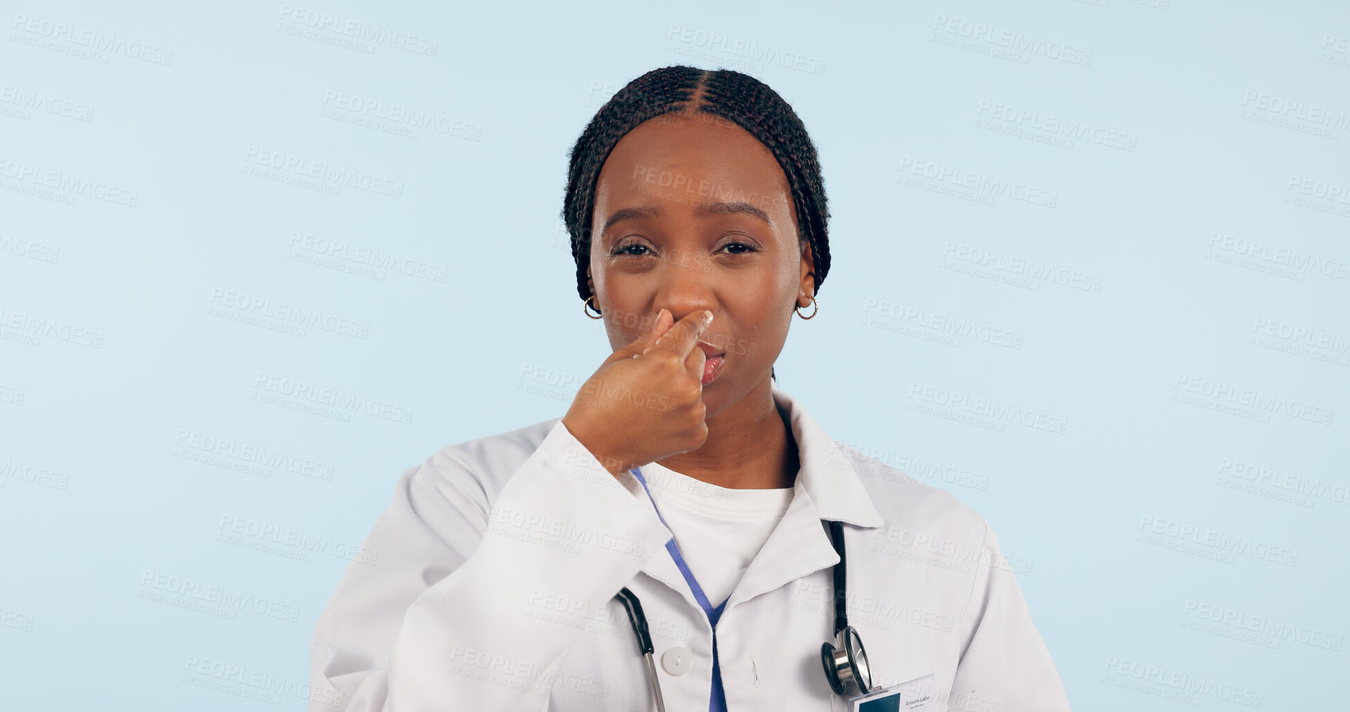Buy stock photo Portrait, black woman and doctor with bad smell in studio isolated on blue background mockup space. Face, intolerable stench and medical professional holding breath, nose and disgust for strong odor 