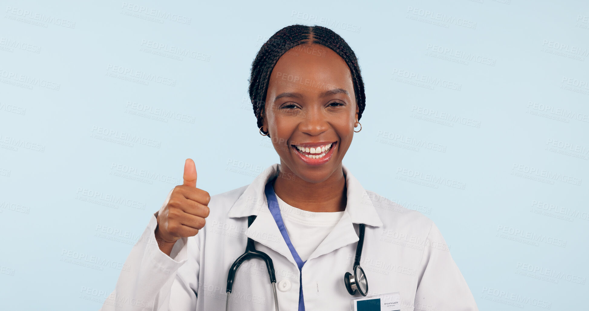 Buy stock photo Black woman, doctor with thumbs up and agreement, healthcare in portrait on blue background. Hand gesture, emoji and medical feedback or review, like or yes with health promotion and smile in studio