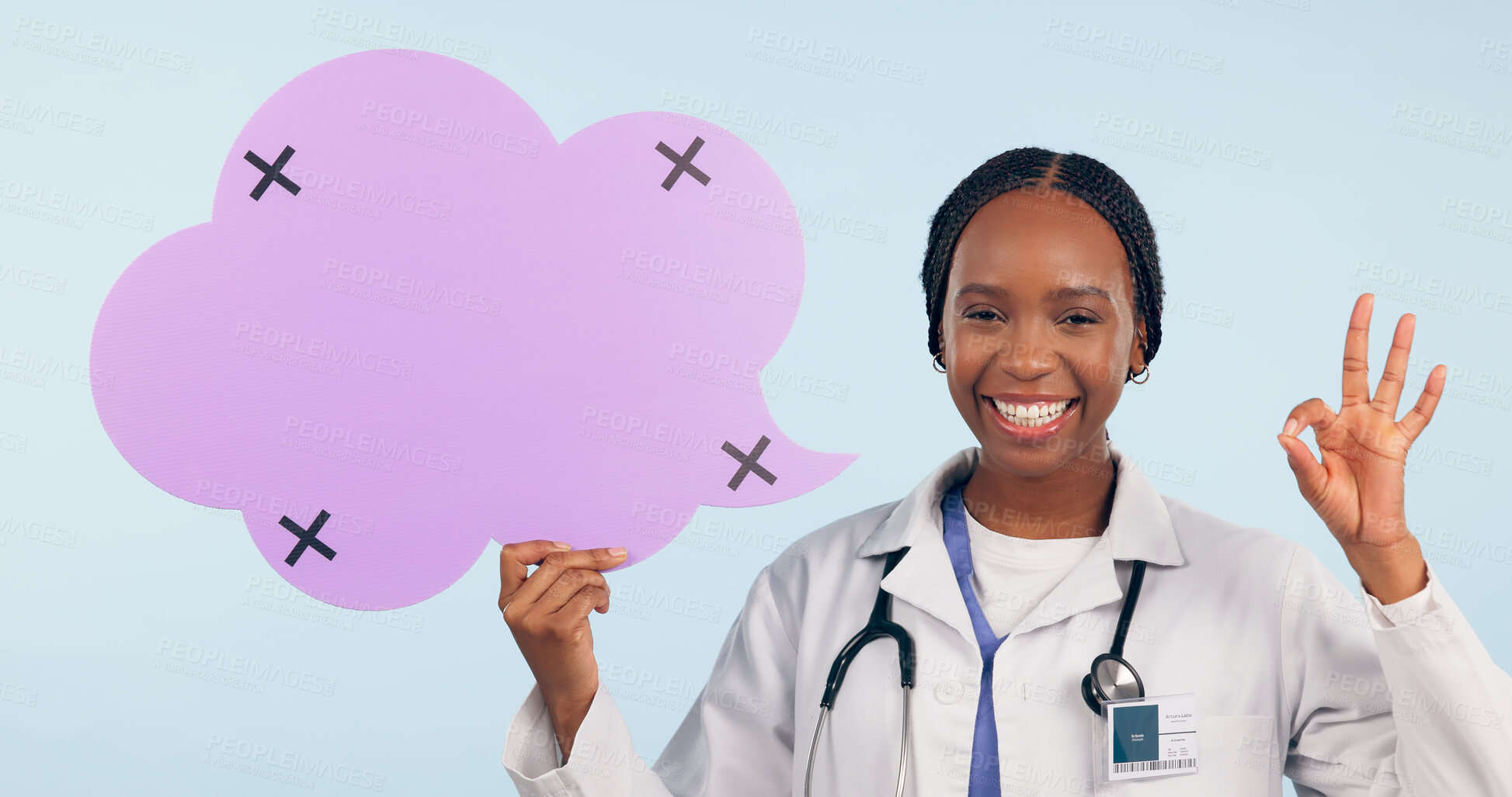 Buy stock photo Happy black woman, doctor and OK sign with speech bubble for social media review against a studio background. Portrait of African female person, surgeon or nurse showing icon, okay or emoji on mockup