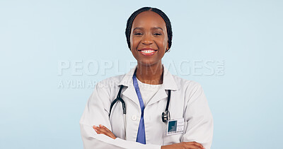 Buy stock photo Happy black woman, portrait and professional doctor with arms crossed on a studio blue background. Face of African female person, surgeon or medical nurse smile in confidence for healthcare on mockup